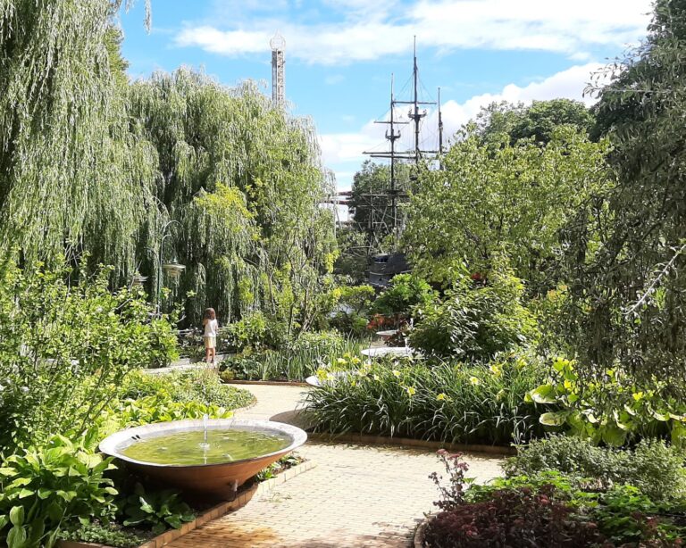Gardens with Rides in Background