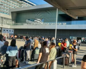 Queuing outside the terminal for a taxi