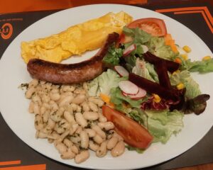 Ken had local sausage, omlette and beans